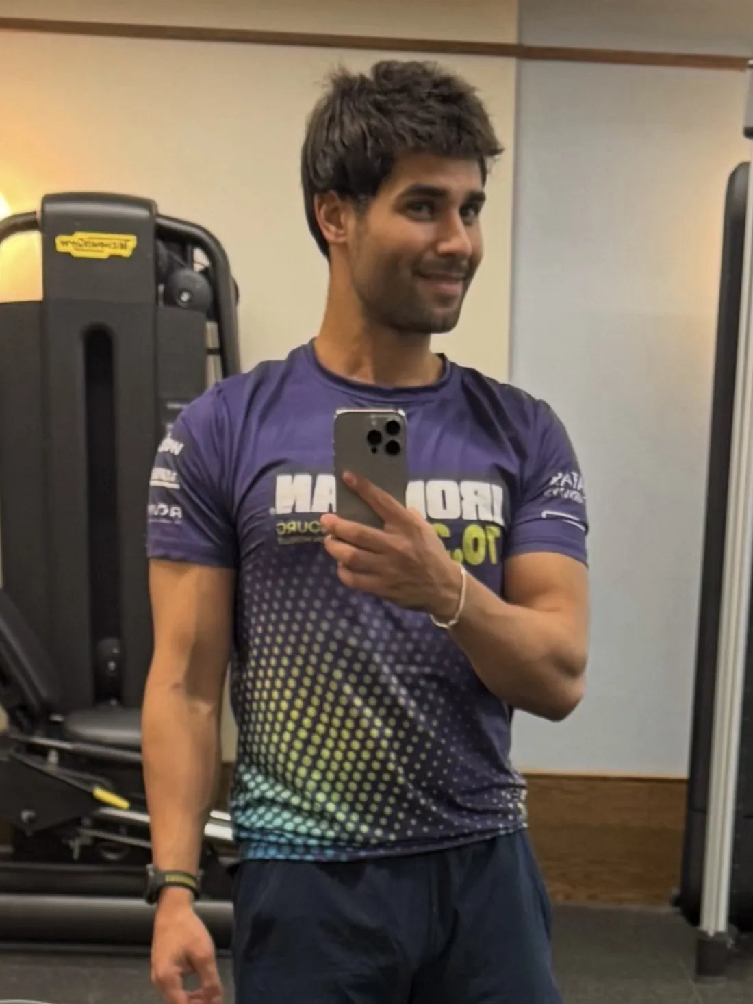 James at the gym in an Ironman 70.3 shirt